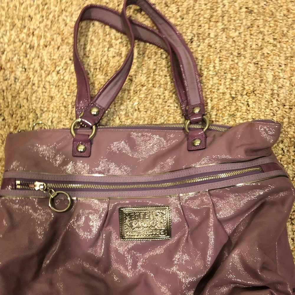 Lavender Coach tote bag.